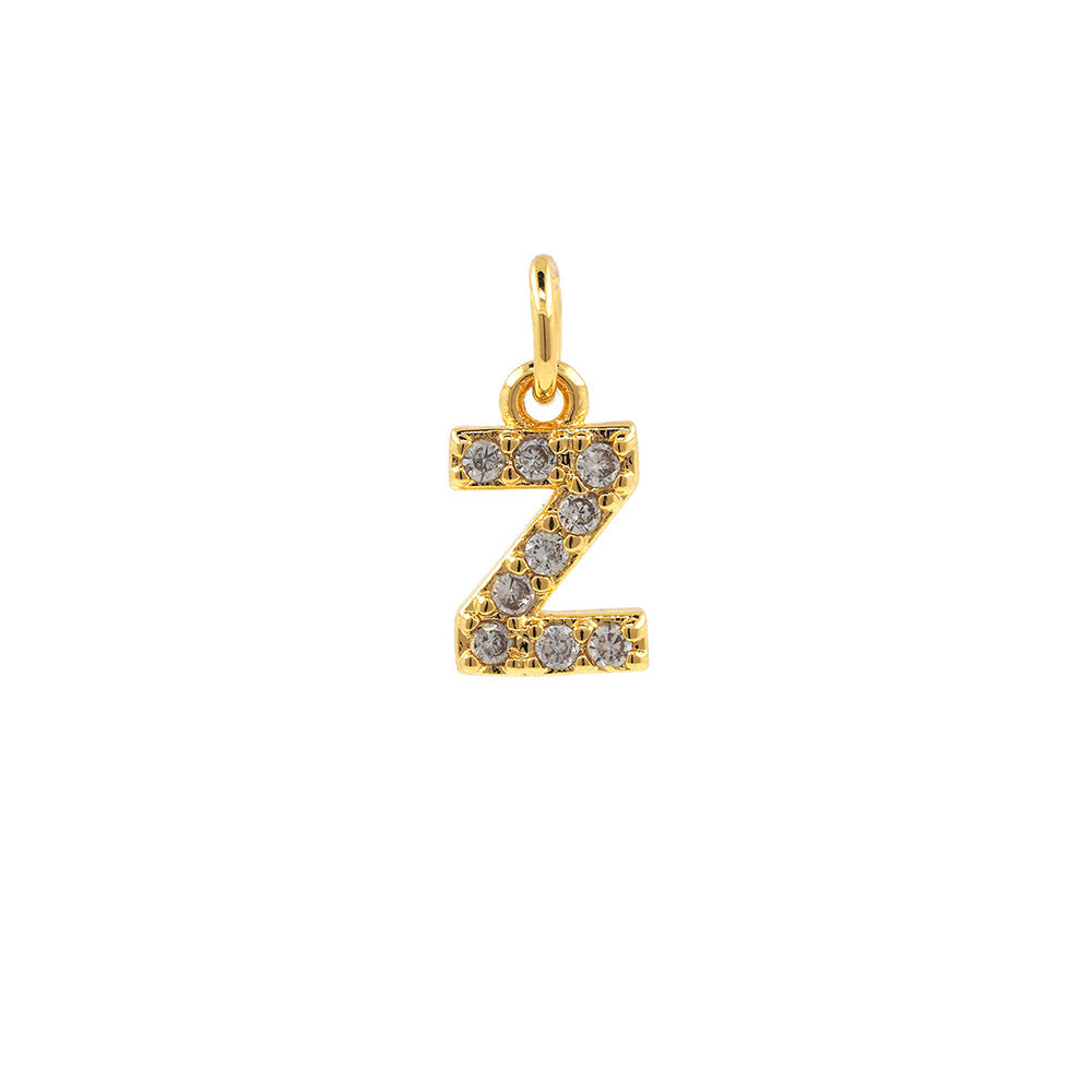 Pendentif avec 26 lettres en cuivre plaqué or véritable